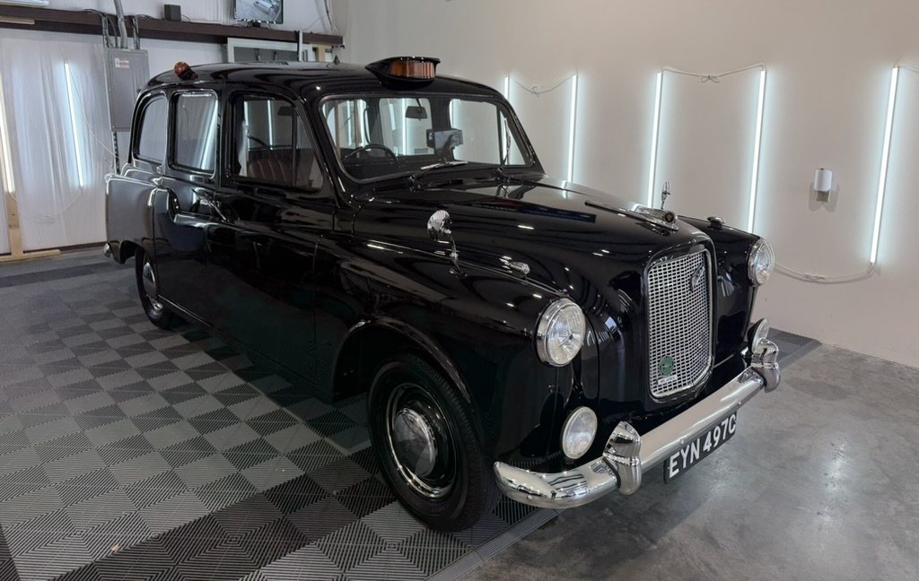 Mr. Jones, a black 1965 Austin FX4 London taxi, freshly detailed at Dre's Detailing.